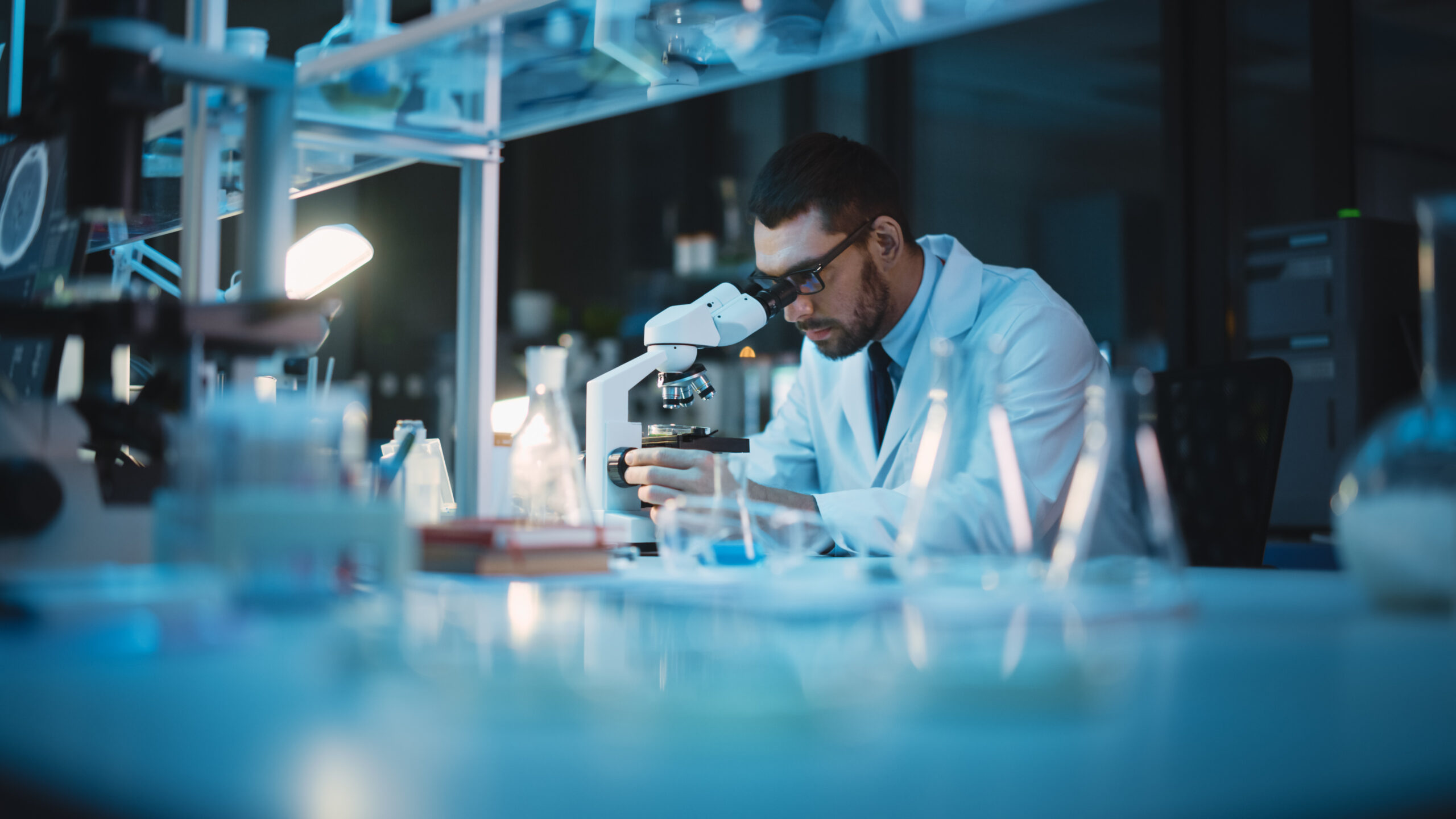medical development laboratory: caucasian female scientist looki